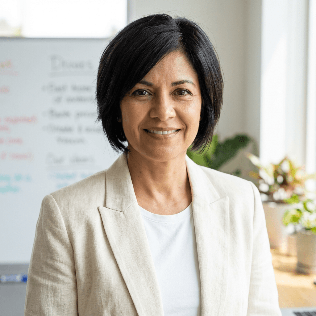 Female practice manager in her early 50s, Hispanic, warm and professional demeanor suitable for healthcare